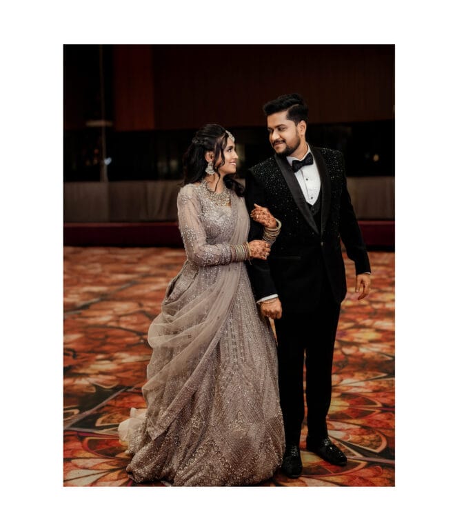 Bride holding hands of Groom during their wedding reception